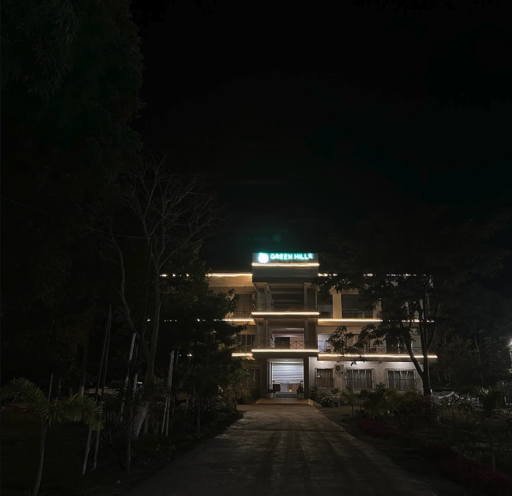 Green Hills Hotel & Resort building illuminated at night